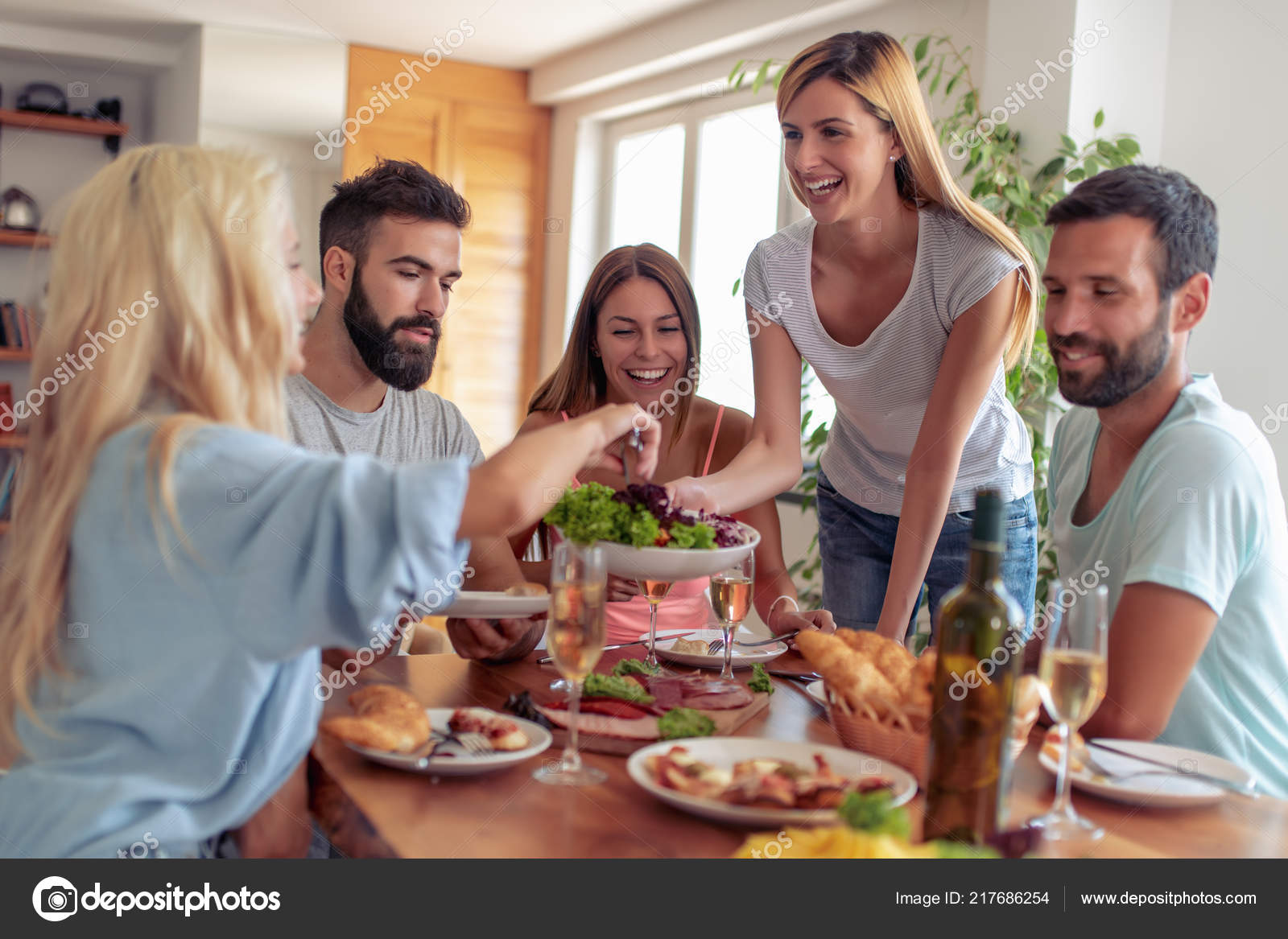 Group Friends Eating Lunch Together Having Great Time Home Stock Photo ...