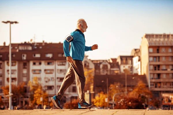 Senior male athlete running in the city.People,sport,fitness and lifestyle concept.