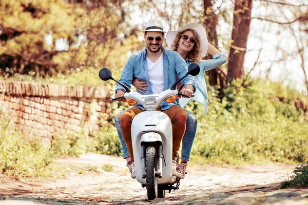 Handsome guy and young woman on travel.Young riders enjoying themselves on trip. Adventure and vacations concept.