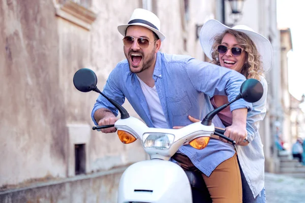 Handsome guy and young woman on travel.Young riders enjoying themselves on trip. Adventure and vacations concept.