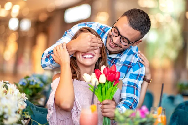 Young Man Make Surprise Flowers Woman Restaurant — Stock Photo, Image