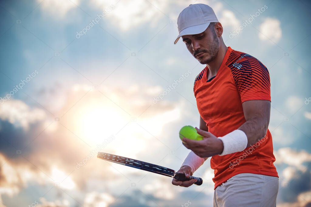 Ready to serve.Young man playing tennis.