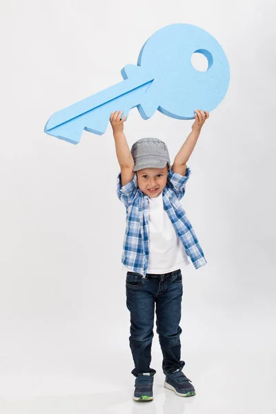 Happy Boy Holding Big Key — Stock Photo, Image