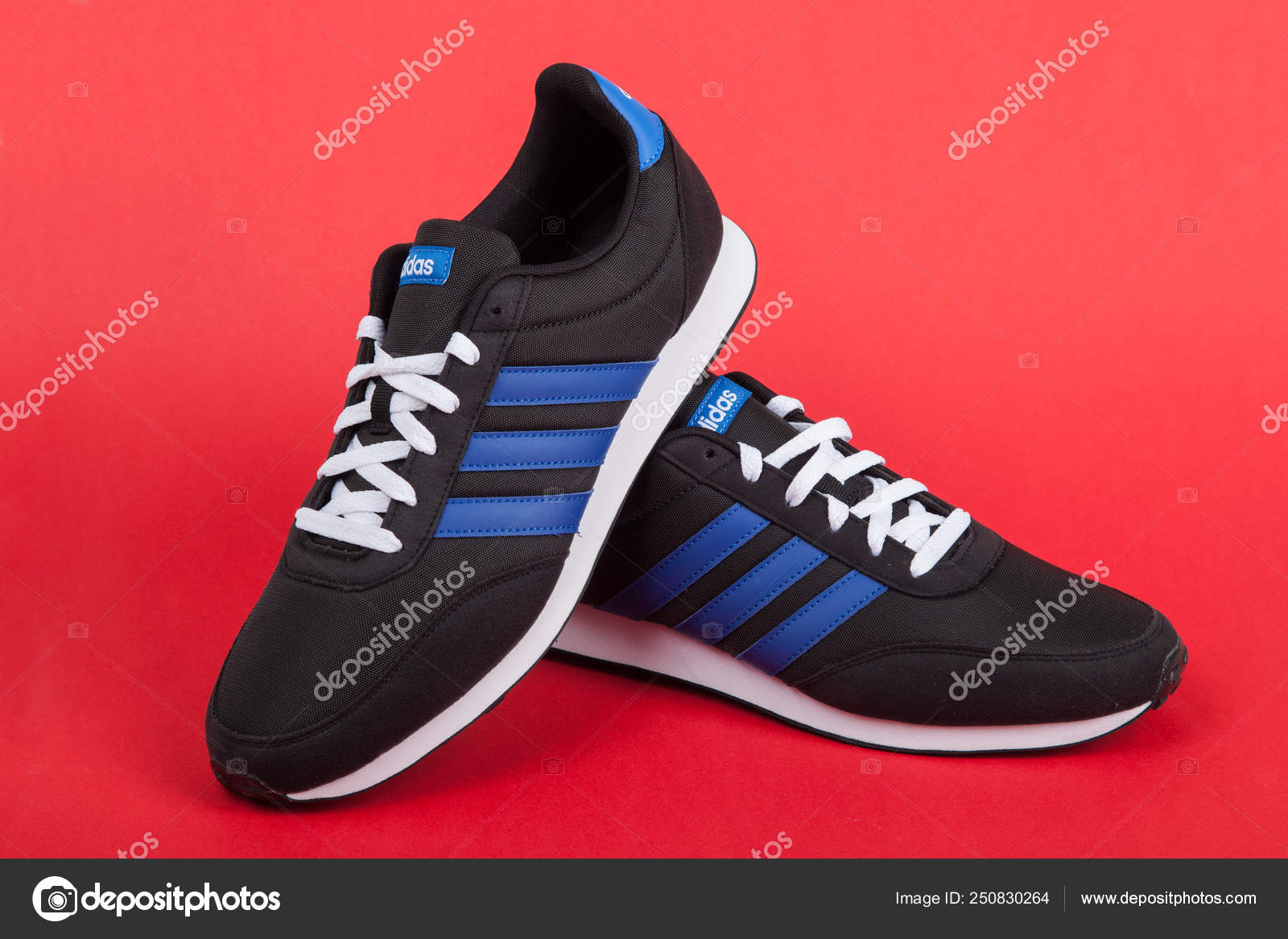 Varna , Bulgaria - JULY 4, 2018 : ADIDAS V RACER sport shoes on red  background.. Product shot. Adidas