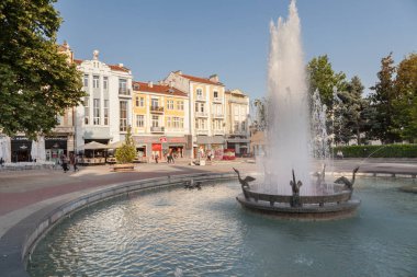PLOVDIV, BULGARIA - JULY 2, 2017: View of fountain on cental street and central square in Plovdiv, Bulgaria. Plovdiv is the European Capital of Culture in 2019  clipart