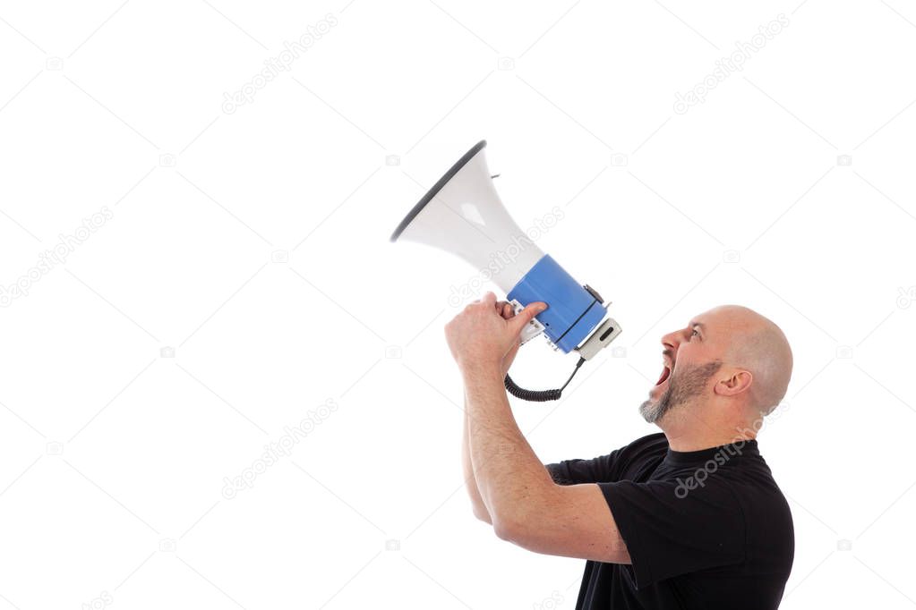 Portrait of angry man shouting with a megaphone. Bearded man yelling into a megaphone, isolated. Copy space for your text 