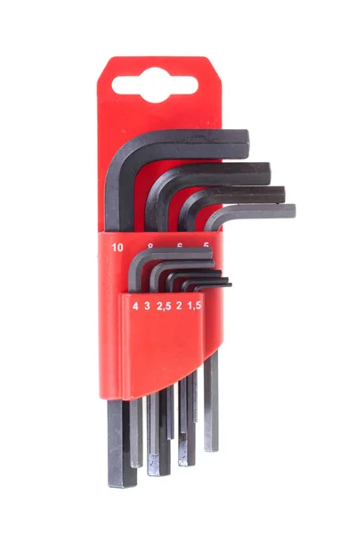 Kırmızı bir kasada birden fazla metal hex anahtarları kümesi, beyaz izole — Stok fotoğraf
