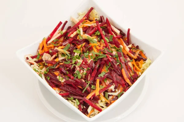 Salad of fresh beets and carrots in white plate — Stock Photo, Image