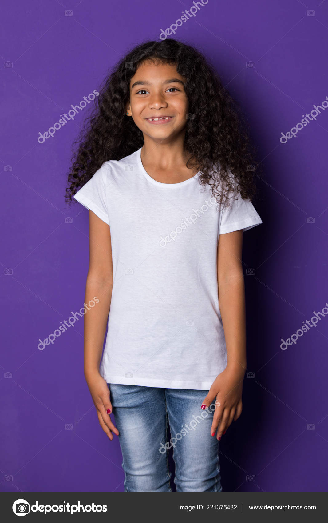 Little African American Girl With Long Curly Hair In A White T