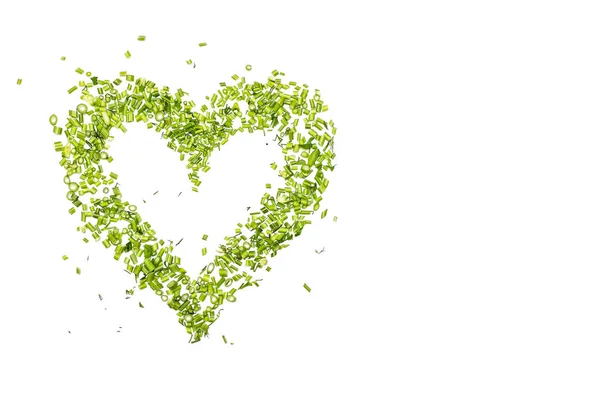 Et grønt hjerte af hakket persille og dild på hvid baggrund - Stock-foto