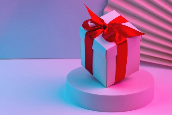 Caja Regalo Con Cinta Roja Sobre Fondo Color Neón Moda — Foto de Stock