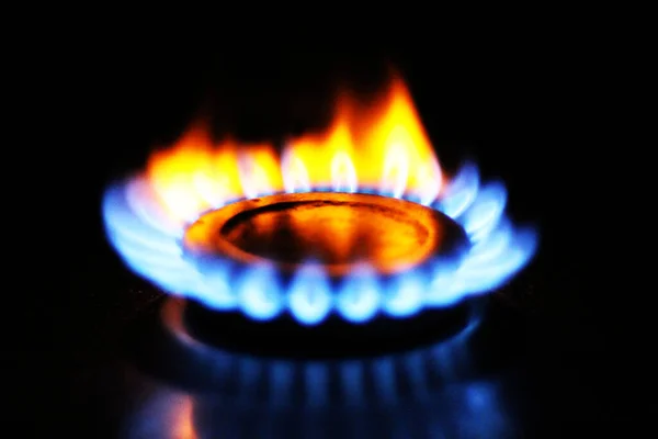 gas burner with burning gas flame