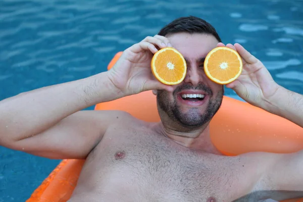 Close Portrait Handsome Young Man Floating Inflatable Mattress Holding Halves — Stock Photo, Image