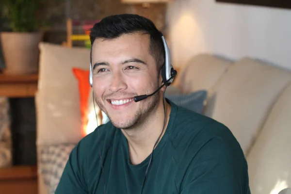 close-up portrait of handsome young man with headphones at home