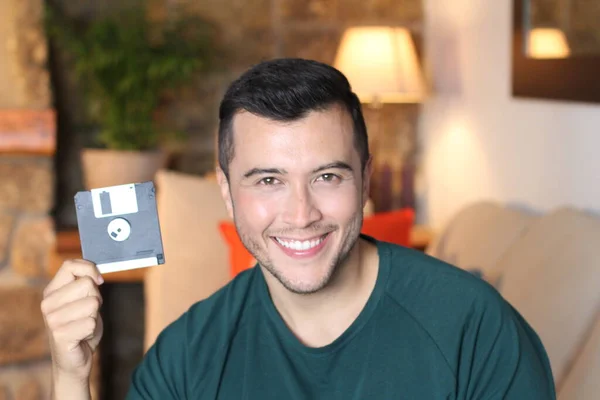 Close Portrait Handsome Young Man Holding Floppy Disk Home — Stock Photo, Image
