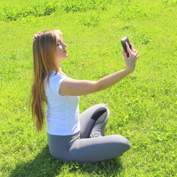 Beautiful Young White Girl White Shirt Long Hair Sitting Green — Stock Photo, Image