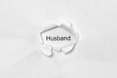 Beyaz arka plandaki sözcük kocası, yaranın içindeki yazı kağıtta. Web için fotoğraf depolama ve metin için boş alan ile yazdırma