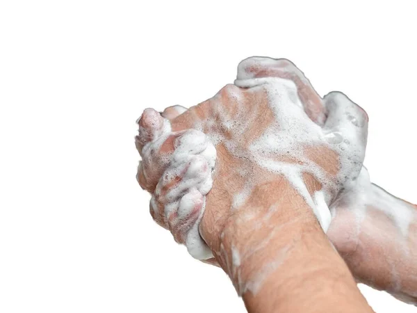 Руки женщины, моющей руки с мылом на белом фоне — стоковое фото