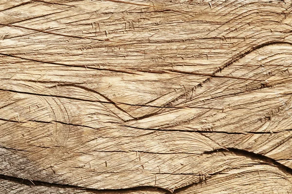 Background of old cracked wood with many traces of cutting. Rough texture of natural wood panel — Stock Photo, Image