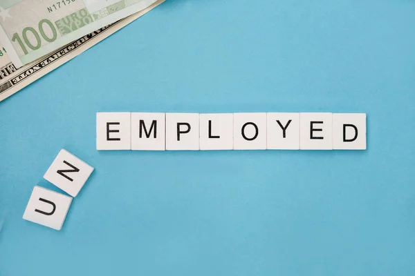 Unemployed Spelled Out Wooden Letter Tiles Blue Background Copy Space — Stock Photo, Image