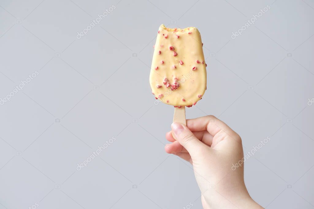 Mango And Strawberry Ice Cream Bitten Young Girl S Hand Holding Yellow Ice Cream With Pieces Of Red Berries Hot Summer Concept Fresh Cold Desserts High Carb Food Larastock Mango And Strawberry Ice Cream Bitten Young Girl S Hand Holding Yellow Ice Cream With Pieces Of Red Berries Hot Summer Concept Fresh Cold Desserts High Carb Food Larastock