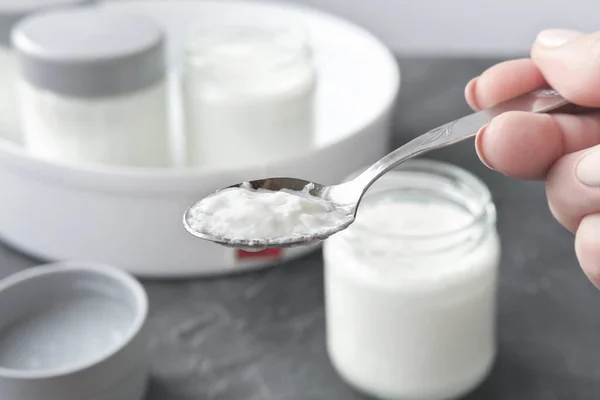 Female Hand Holding Spoon Kefir Yogurt Made Automatic Yoghurt Making Stock Image
