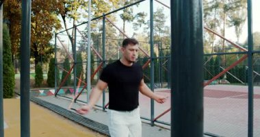 A fit man is skillfully skipping rope, showing remarkable athleticism and dedication in a beautiful park