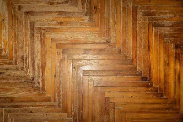 texture of wooden parquet (herringbone). Old wood flooring.