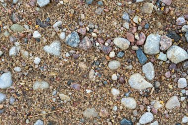 Kum, çakıl ve çakıl taşlarının arka planı.