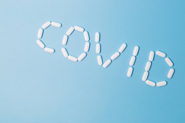 COVID-19 metni haplar ve vitamin haplarıyla yapılmış.
