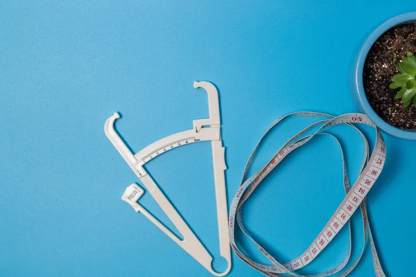 Close up of a tame measurement and body fat caliper. — Stock Photo, Image