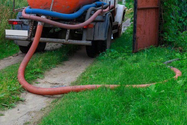 A Sewage truck working in village environment — Stock Photo, Image