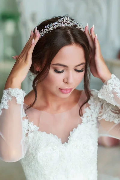 Close-up portrait of the bride with tiara with crystals