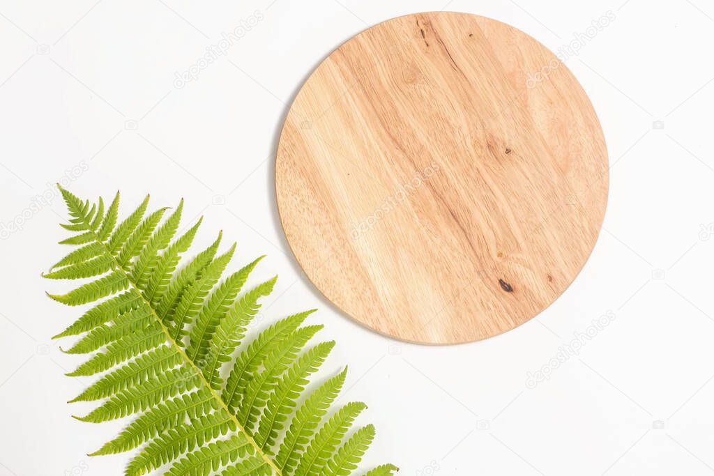 Bamboo Cutting Board with green leaf of fern on white background