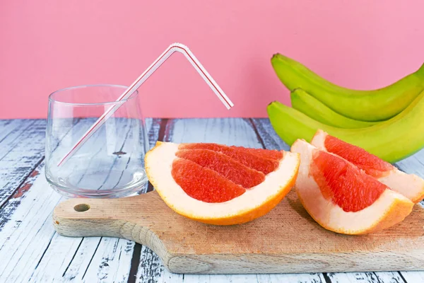 Two ripe slice of red grapefruit