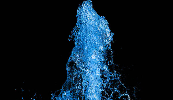 colored water splashes on black background 