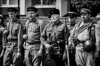 People in military uniform in honor of the Victory Day holiday. Military historical society, reconstruction of the appearance of fighters of the Second World War II. Rostov-on-Don. Russia 09.05.2018 clipart