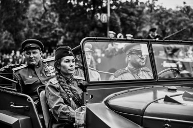 People in military uniform in honor of the Victory Day holiday. Military historical society, reconstruction of the appearance of fighters of the Second World War II. Rostov-on-Don. Russia 09.05.2018 clipart