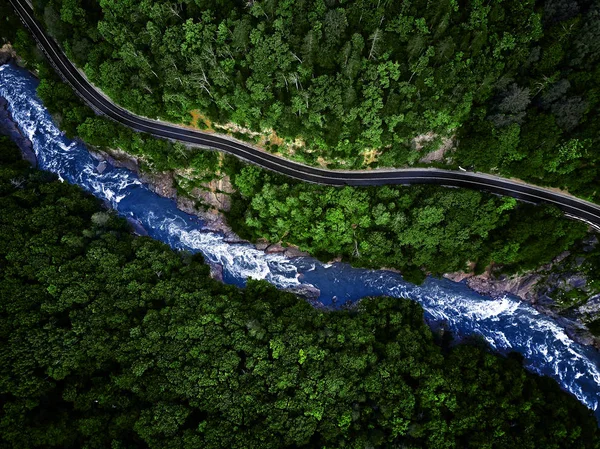 Mountain river and road aerial view