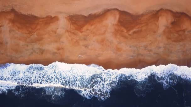 Flying over a sandy beach. Waves break on a sandy beach on the Atlantic coast, aerial View. Nazare, Portugal. — Stock Footage Flying Sandy Beach Waves Break Sandy Beach Atlantic Coast Aerial Stock Video