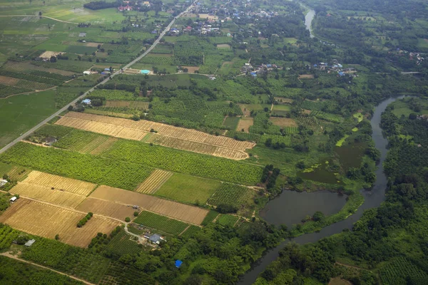 Farmer field village with river and road bird eyes view