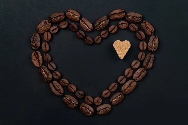 Roasted Coffee Beans Placed Shape Heart Brown Sugar Black Background — Stock Photo, Image