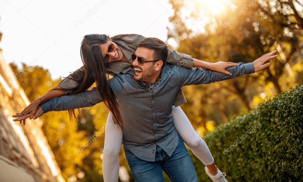 Couple in love having fun outdoors.Enjoying nice weekend together.Loving couple hugging outdoors.