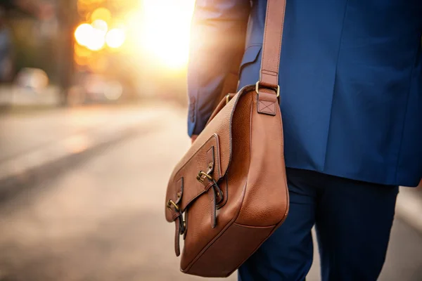 Close up of a businessman holding his briefcase.Business and travel concept.