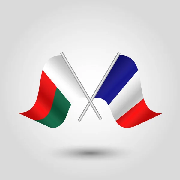 Vector two crossed malagasy and french flags on silver sticks - symbol republic of madagascar and france — Stock Vector