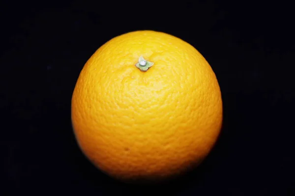 Isolated orange in a black background