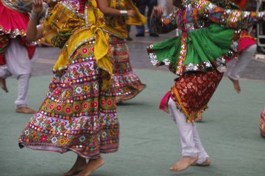 Indian folk dance in a street festival clipart