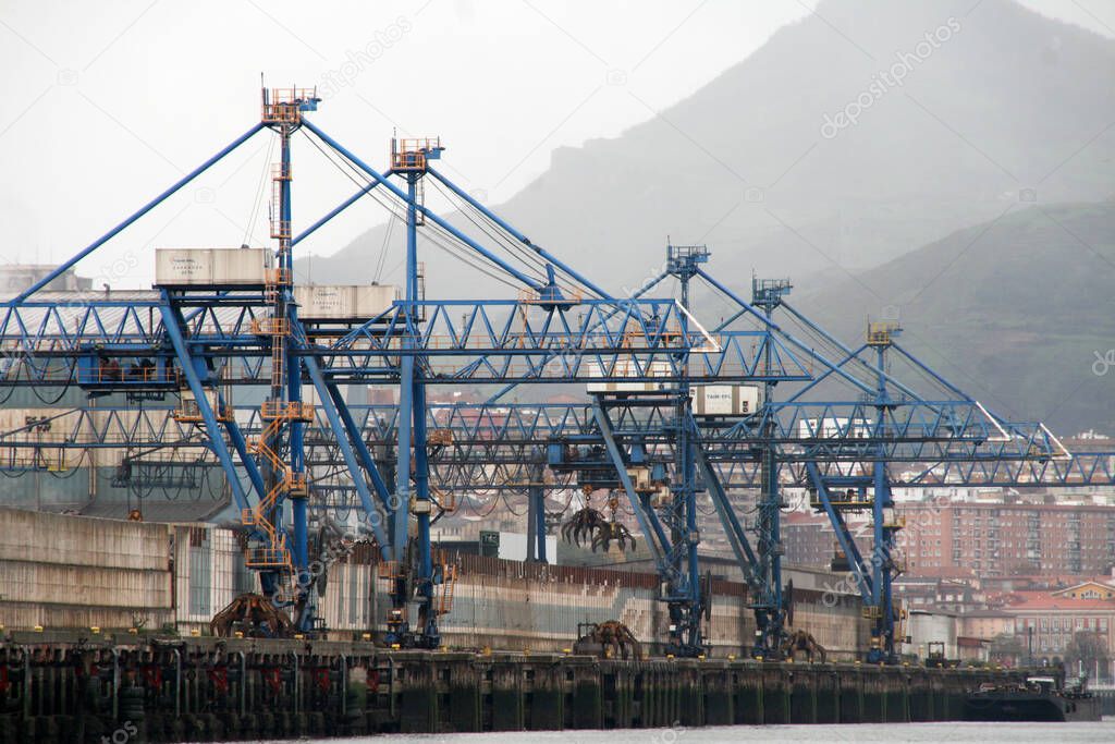Industrial environment at the estuary of Bilbao in a rainy day