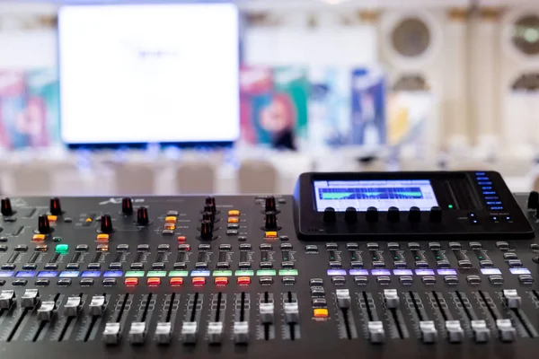 Professional Audio Sound Mixing Console Faders in seminar room.