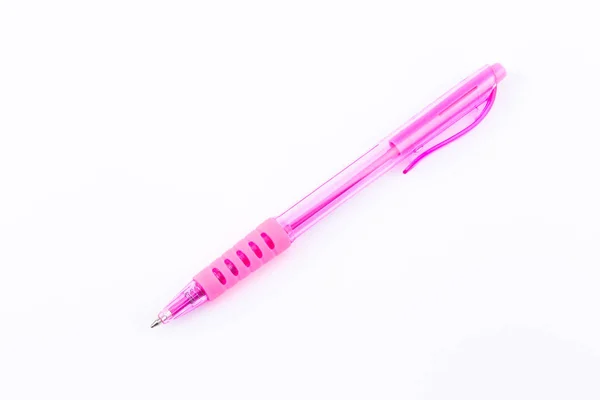 Pink ballpoint pen on white background. — Stock Photo, Image